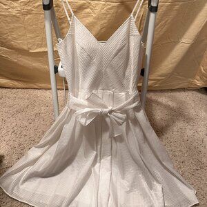 Off-white ruffled style dress with strips and V neck, and same fabric belt
